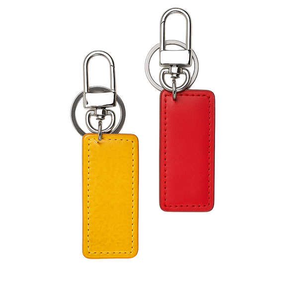 Two rectangular keychains, one yellow and one red, with metal hooks on a white background.