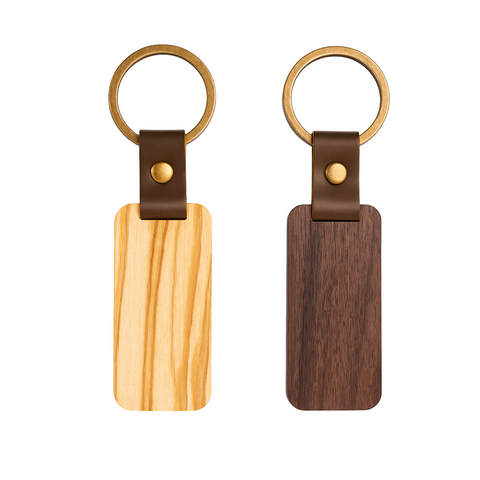 Two wooden keychains with leather straps on a white background