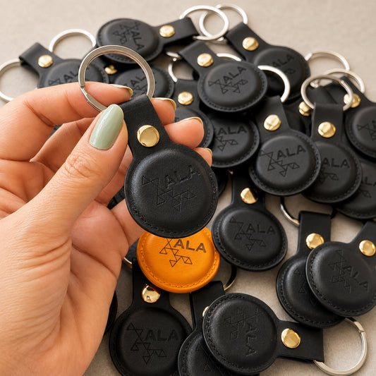 Bulk faux leather AirTag holders engraved with a company logo, 10 piece minimum