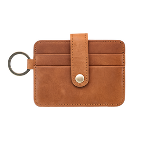 Brown leather key fob with a key ring on a white background