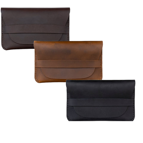 Three leather wallets in brown, black, and another shade of brown on a white background.
