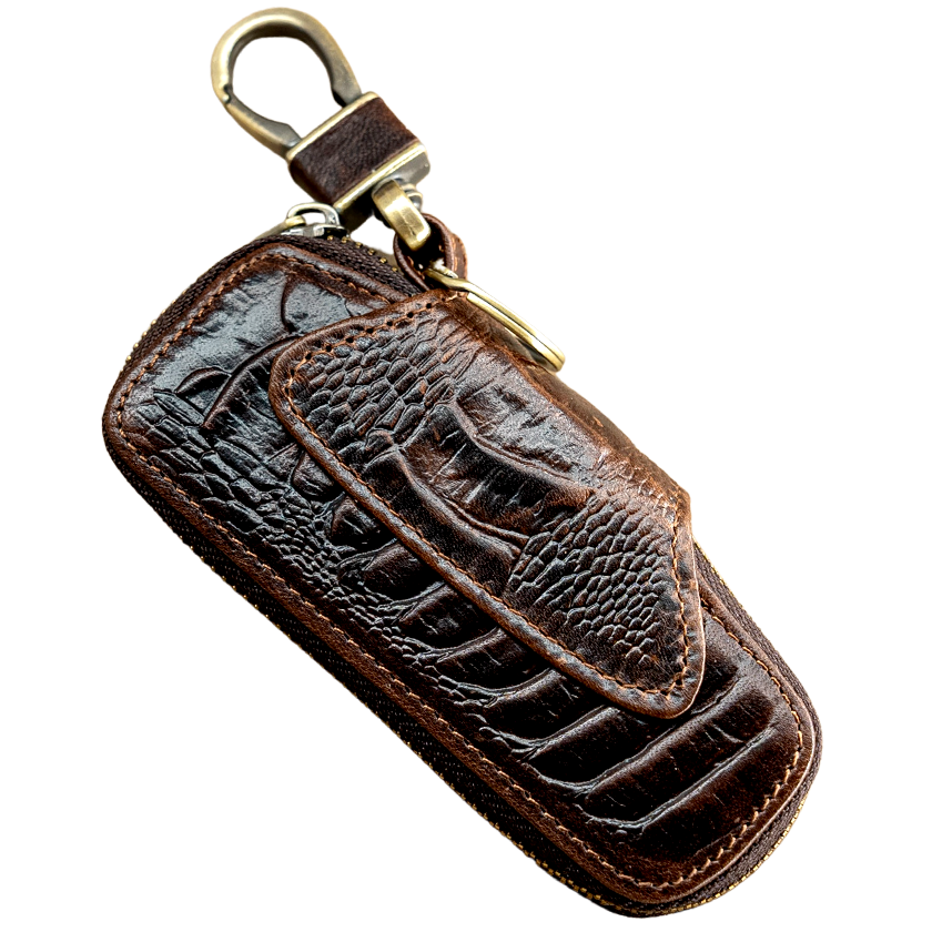 A brown genuine leather car key holder with a crocodile pattern and a metal key ring.